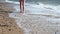 Barefoot walking on the beach, North Sea, England.