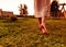 Barefoot woman walking on grass. Silence, privacy with nature, life enjoyment, freedom concept.