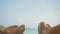 Barefoot young man and woman rest lying on beach near ocean