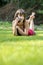 Barefoot young woman chatting on a mobile phone as she lies on h