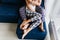 Barefooted woman and man chilling together on blue sofa. Indoor overhead portrait of relaxed couple spending weekend at