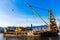 Barge dredging a harbor