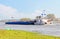 Barge at Elbe river. landscape in saxony anhalt Germany. Willow trees and meadows