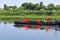 A barge loaded with buoys is sailing along the Neman