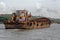 A Barge Moving Slowly In The Water Of River Mondovi Seen From Island