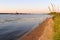 Barges and dredgers on the Volga River in summer, sandy river bank, Yaroslavl Region