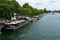 Barges parked on the banks of the quays in Paris