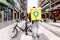 Bari, Italy - March 12, 2019: Rider of Glovo blocking his bike, his backpack box to the back