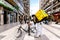 Bari, Italy - March 12, 2019: Rider of Glovo blocking his bike, his backpack box to the back