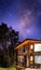 BARILOCHE, ARGENTINA, JUNE 19, 2019: Exterior of a wooden cozy and relaxing cabin in the forest with an amazing starred