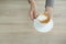 Barista in apron in coffee shop give just brewed fresh coffee to customer