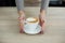 Barista in apron in coffee shop give just brewed fresh coffee to customer