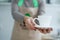 Barista in apron in coffee shop give just brewed fresh coffee to customer