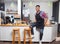 Barista coffee shop owner handsome man happy smile sitting on bar