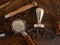 Barista coffee tools and roasted coffee beans on wooden board