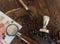 Barista coffee tools and roasted coffee beans on wooden board