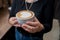 Barista girl holding fragrant freshly made cappuccino in her hands.