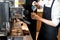 Barista hand make baverage from coffee machine in coffee shop