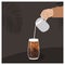 Barista hand pouring milk in black ice coffee in transparent glass. Iced tea asian style drink. Vector trendy minimalist