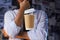 Barista and levitating paper cup of hot coffee