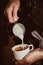 Barista makes cappuccino