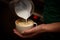 Barista pouring milk in a coffee cup
