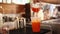 Barista pouring tea in a take away glass make summer iced tea.