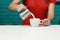 Barista prepares cappuccino in his coffee shop. close-up