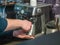 Barista prepares coffee at the coffee machine. Man hands close-up. Photo behind the bar counter with blurred background