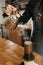 Barista preparing coffee in aeropress. barista holding stainless kettle and pouring hot water to aeropress.