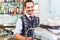 Barista preparing coffee or espresso in cafe bar