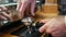 Barista is Pressing Ground Coffee in a Cafe Shop and Making Coffee using Machine