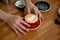 Barista putting cup of coffee on table