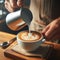 Barista server creates latte patterns in coffee foam