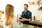 Barista serving coffee to customer