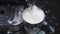 Barista steaming milk in frothing pitcher in slow motion. steam wand heating milk. milk splashing due to mistake. fail work spilli