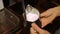 Barista whipping milk in a jar on a professional coffee machine