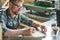 Barista Writing Making Notes on Coffee