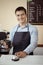 Baristas hand taking cup of hot coffee and bakery to offering to customer  in coffee shop