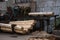 Bark removal from large logs on sawmill. Preparation of the wooden logs to sawing on a cutting line on a saw mill