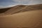 Barkhans of the Sahara desert. Tent in the sand. People in the desert