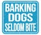 BARKING DOGS SELDOM BITE, words on blue stamp sign