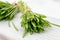 Barley grass blades on a white table