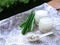 Barley water in glass and cooked pearly barley with pandan leaves