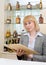 Barmaid at a bar with wine list