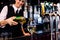 Barmaid serving a glass of wine