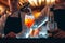 Barman hand stirring a fresh and sweet orange summer cocktail with a spoon on the bar counter.