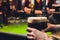 Barman hands pouring a lager beer in a glass.