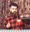 Barman or hipster pouring glass, makes fresh drink with ice