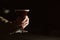 Barman holding espresso martini cocktail in darkness. Space for text